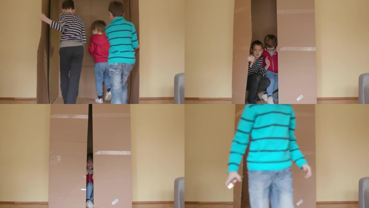 Children playing with cardboard box