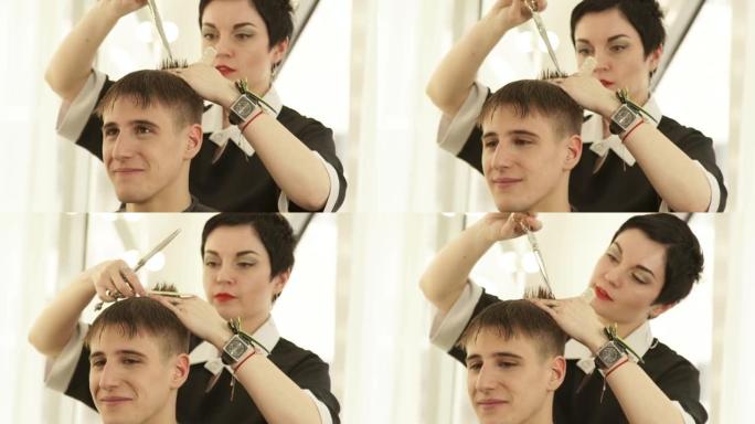 在男性理发店用美发剪刀和梳子剪发。美发工作室用美发剪刀做发型和梳理湿头发