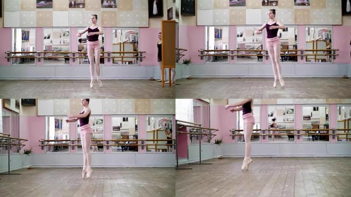 在舞厅里，穿着黑色紧身衣的年轻芭蕾舞演员表演巡回演出，她优雅地穿越芭蕾舞课
