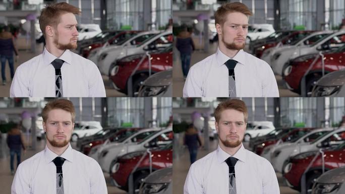 站在自动中心的年轻经理的肖像，慢动作