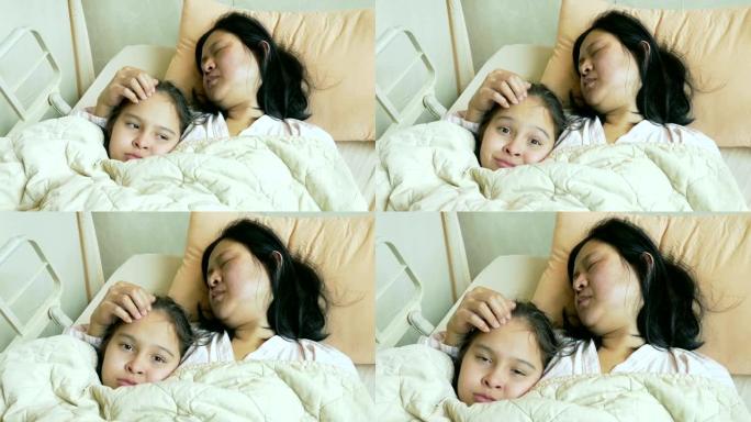 生病的母亲在医院的病床上抚摸着孩子的头发