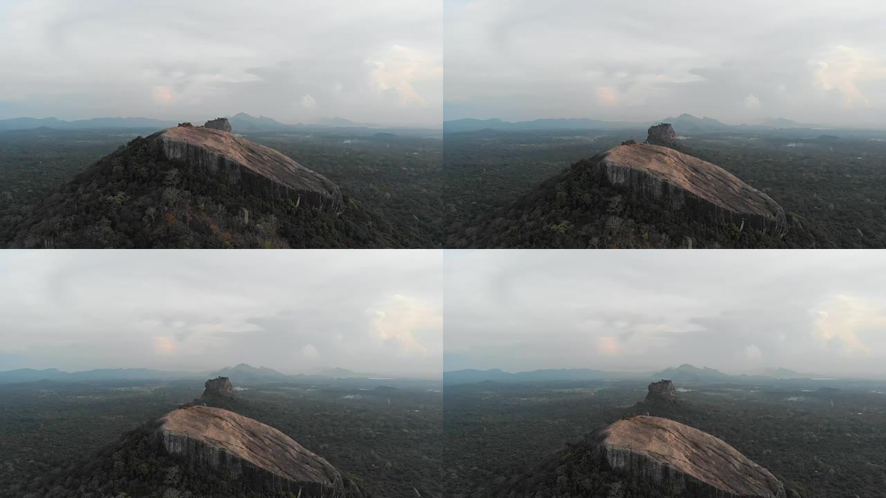日落时分，Pidurangala和Sigiriya Rock的空中电影倾斜飞行。斯里兰卡旅游最多的地