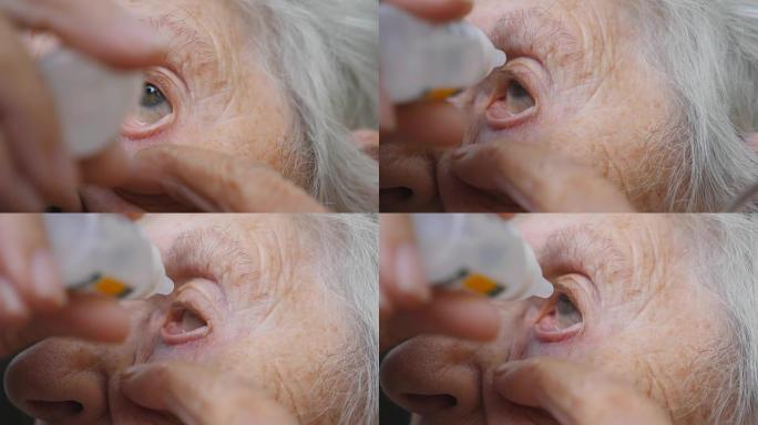 多莉在户外戴眼镜的老妇人的照片。一位年老女士的眼睛，周围有皱纹。外祖母的肖像。关闭慢动作