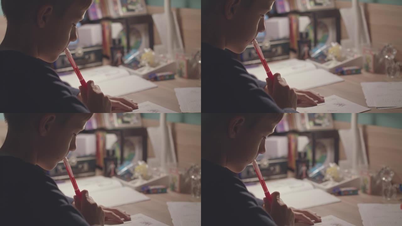 Boy looking at his drawing in deep thaughts