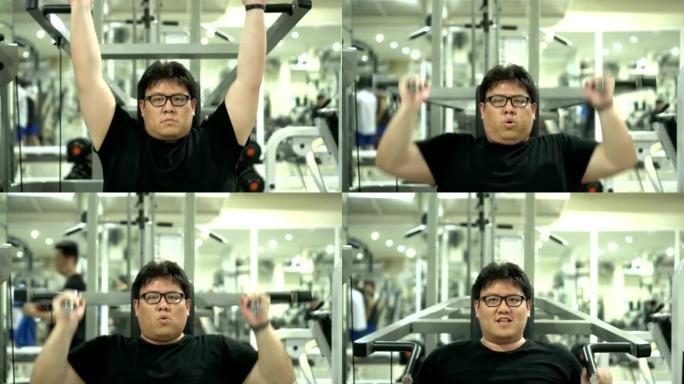 做肩部锻炼的亚洲胖子