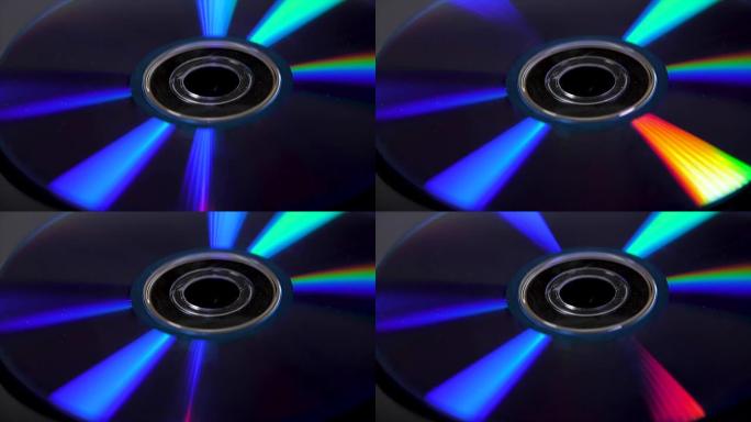 黑色背景的孤立CD。丰富多彩的抽象背景。CD的特写。黑色背景上的DVD光盘-横向格式