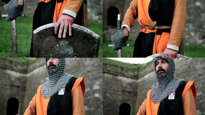 战斗后的中世纪骑士。手臂上有血。真正的伤害