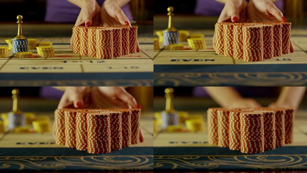 赌场赌场老板在黑杰克桌上移动筹码。用RED EPIC DRAGON电影摄影机慢动作拍摄。