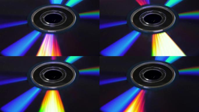 光盘或dvd的背景。炫目的光照射在DVD光盘上，美丽的彩色眩光来自DVD光盘的背景