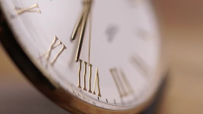 Gold watch second hand close up