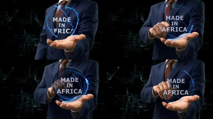 商人在他的手上展示了非洲制造的概念全息图