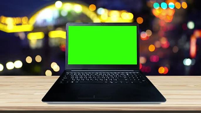 Laptop computer view with green screen on the empt