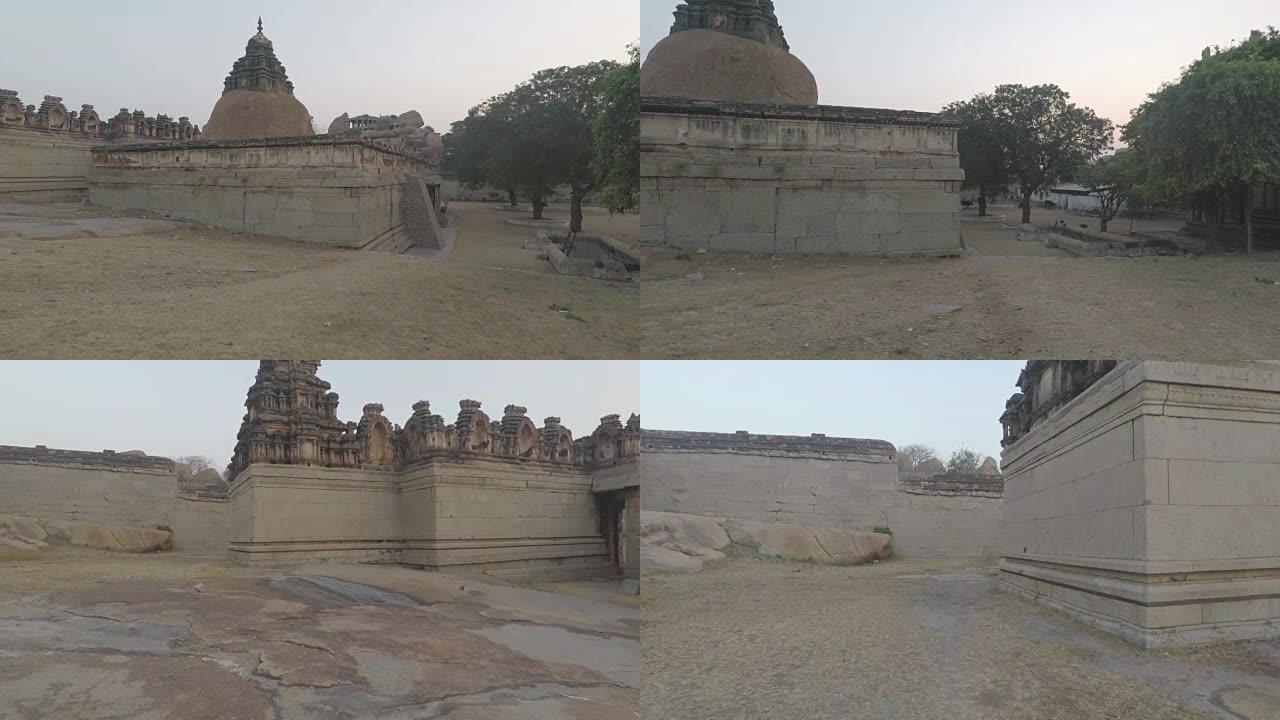 印度亨比美丽的古庙。在寺庙后面拍摄的平稳跟踪。