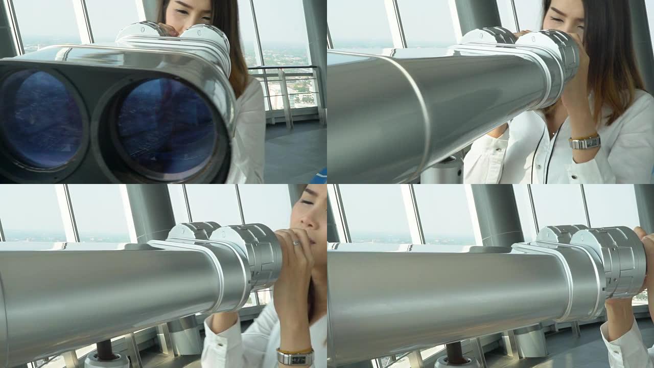 女人用双筒望远镜