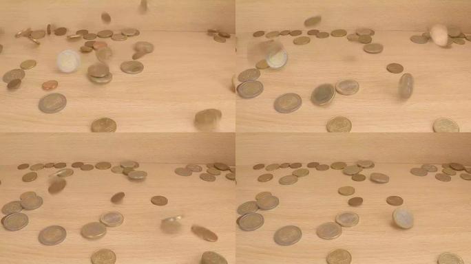 欧洲货币硬币掉落在木板上