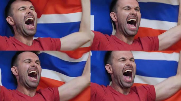 挪威球迷在慢动作中举着挪威国旗庆祝，4k，高品质