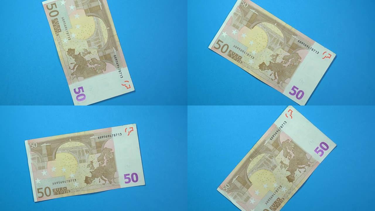 50欧元在旋转的蓝色背景上缓慢旋转。