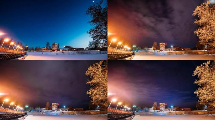 白俄罗斯戈梅利州多布拉什。冬季旧纸厂塔从晚上到晚上的延时延时。夜星天空高于历史遗产和地标