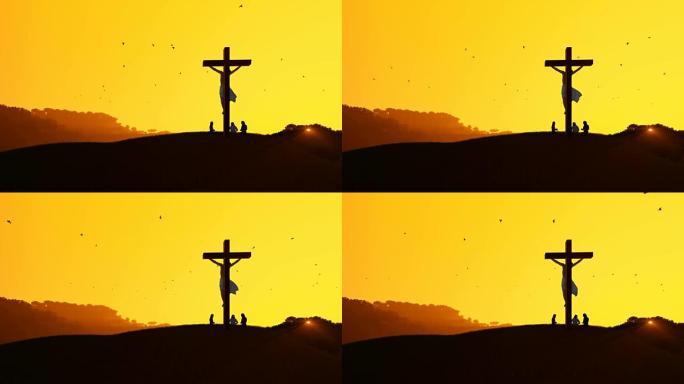 十字架上的耶稣和信徒为炎热的日落祈祷
