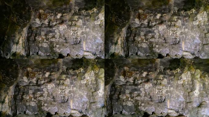 砂岩洞穴中的历史绘画。聚焦墙上的历史艺术。