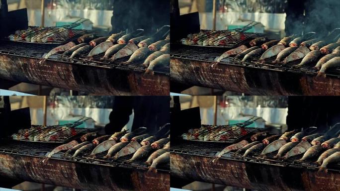 烤架上的烤鱼。诺曼底法国北部的鲱鱼博览会。街边市场上美味可口的海鲜。色调