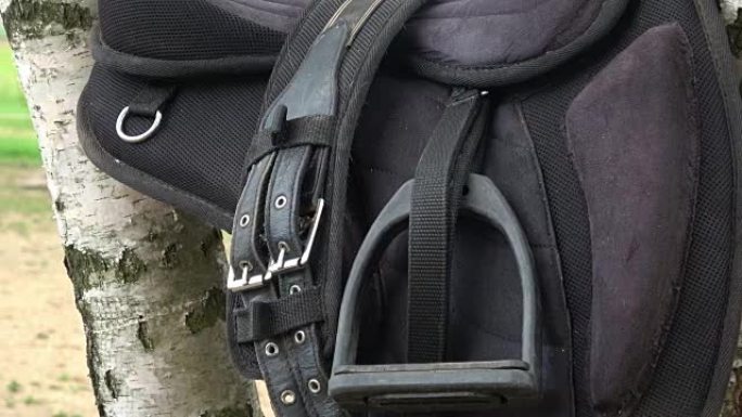Detail of a horse saddle. Saddle with stirrups.