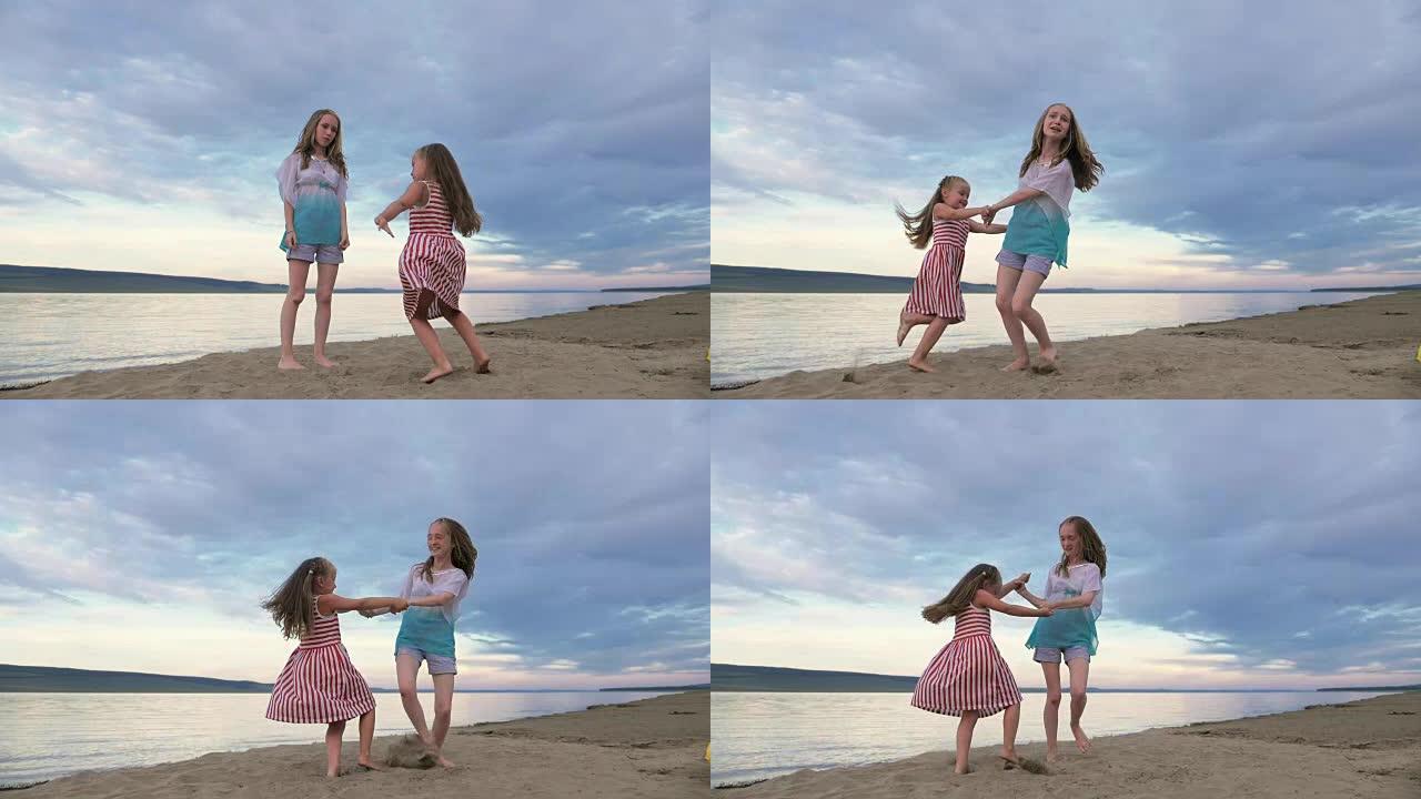 两个孩子在沙滩上跳舞和放纵。