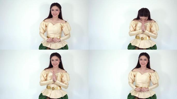 泰国传统服饰的快乐美女表示敬意