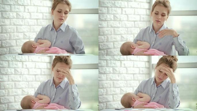不快乐的女人手里拿着熟睡的婴儿。压力母亲概念