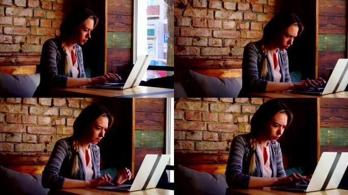 女性文案作者在咖啡馆用笔记本电脑写文章