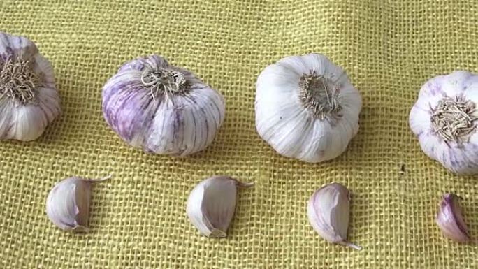 Dry garlic on the yellow jute sack