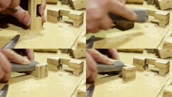 手锯木条，用砂纸研磨木材