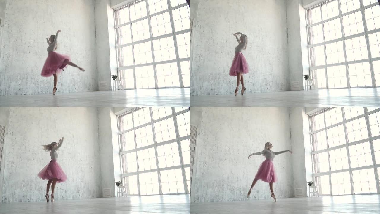 优雅的年轻芭蕾舞演员在巨大的光窗的背景下跳舞。经典芭蕾舞短裙和尖角芭蕾舞演员