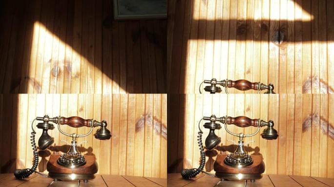 木制桌子上的老式手机和太阳相机上的木墙