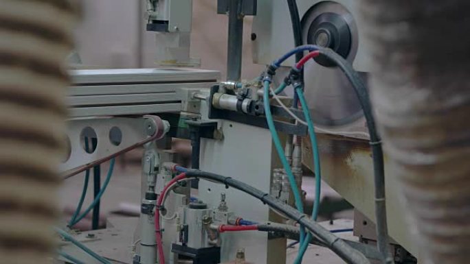 Cutting of wooden bars in the factory