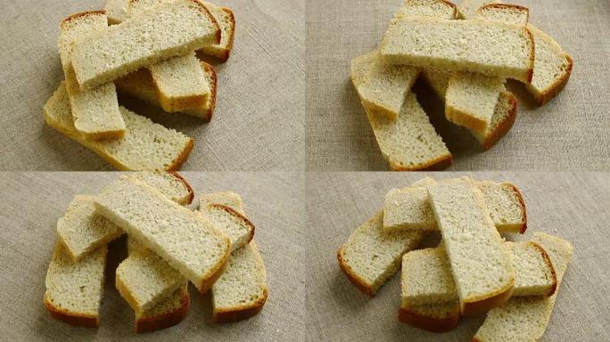 面包被切成碎片，缓慢旋转。