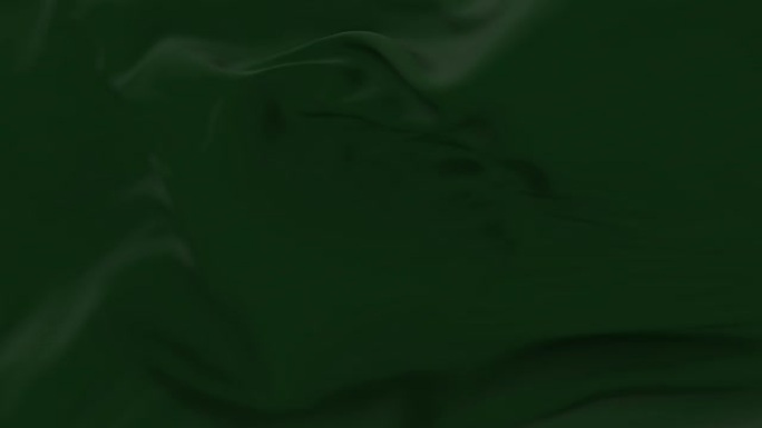 深绿色的布或丝绸在缓慢的循环中随风飘动