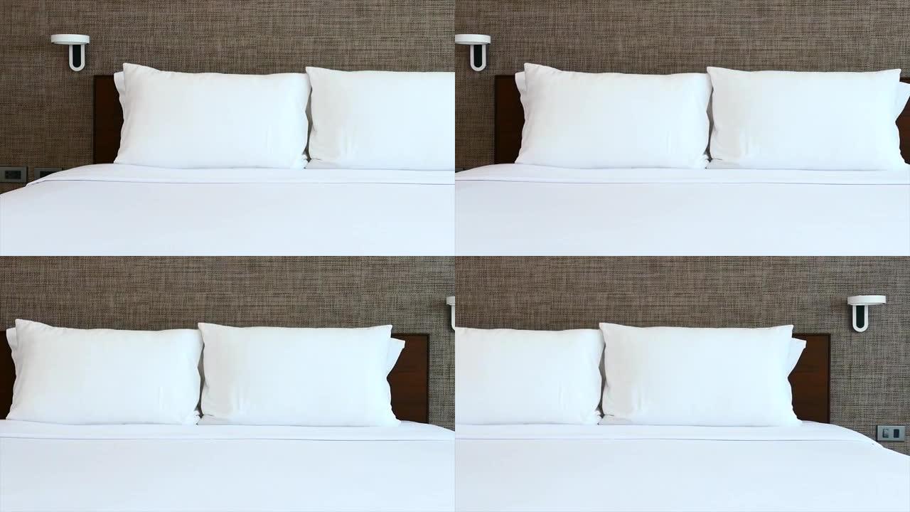 卧室内部床上装饰白色枕头