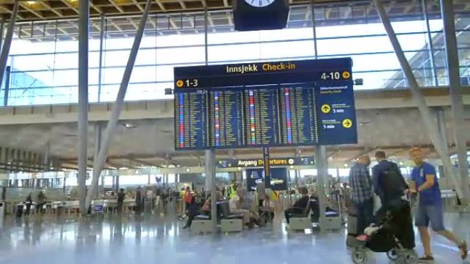 人们在奥斯陆机场行走的4k延时镜头。这是服务于挪威首都的主要国际机场。