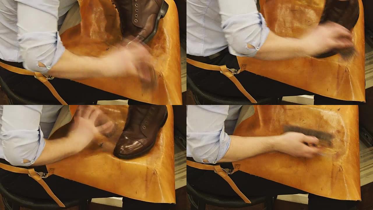 擦鞋匠用特殊的刷子擦亮棕色皮革的靴子