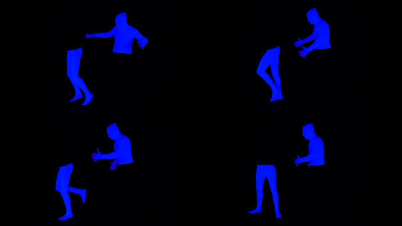 紫外线下半部和上半部-腿部和躯干哑剧相互作用。腿从身体上跑了。黑色场景中的单色蓝色。