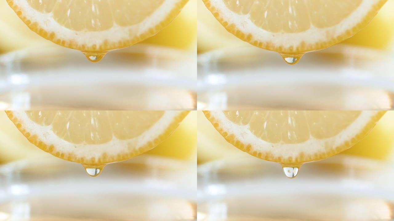 特写慢动作视频，果汁滴从柠檬片的侧面慢慢滴落