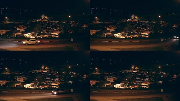 室外停车场，夜间和城市交通有很多车，城市场景