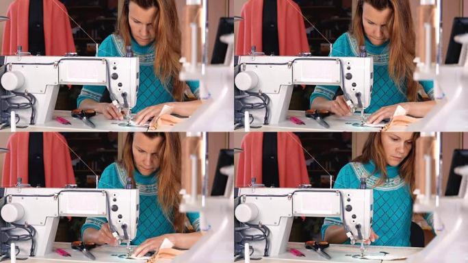 裁缝在工业缝纫机上缝制。