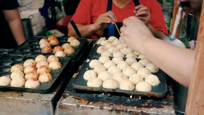 章鱼烧，街头烹饪球状饺子大鱿鱼油炸小吃