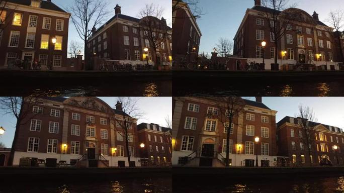 日落时荷兰阿姆斯特丹运河沿岸的中世纪建筑