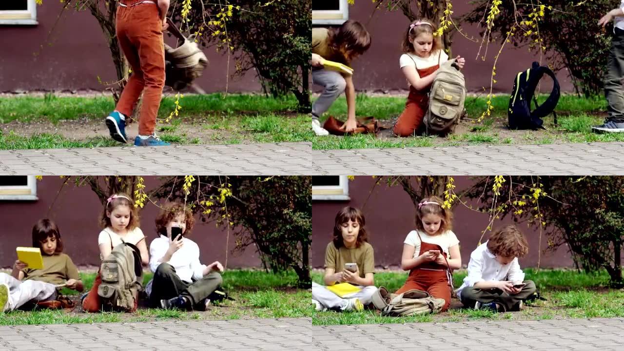 学童放学后坐在草地上，从书包里拿出智能手机，玩网络游戏。网络成瘾。电子游戏