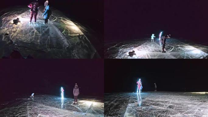 家庭正在滑冰之夜。女孩和男孩在大自然中骑花样冰鞋。母亲，女儿和儿子一起在裂缝中的冰上骑行。运动员的户