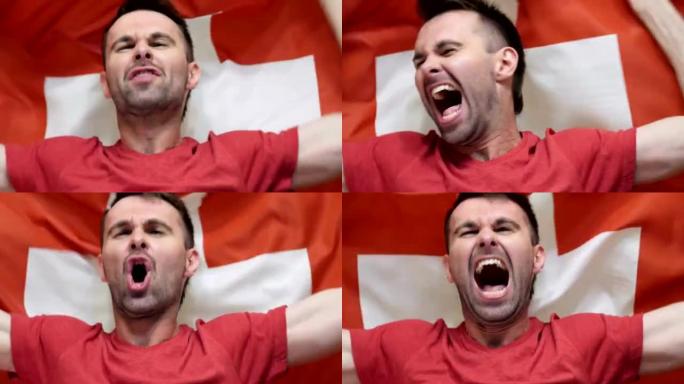 瑞士球迷庆祝举着瑞士国旗慢动作，4k，高品质