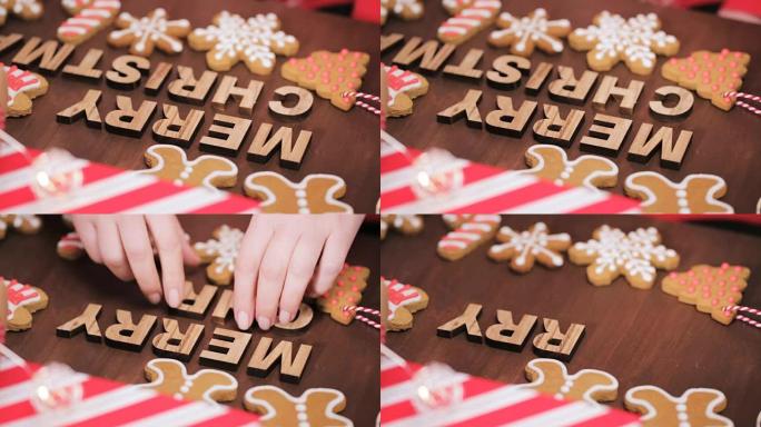 木质圣诞快乐标志和传统姜饼饼干自制。